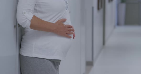 Pregnant woman standing in hospital