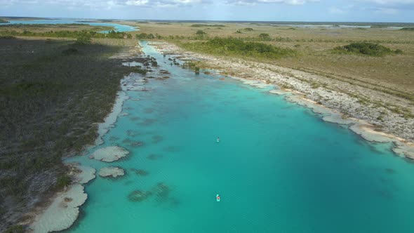 People Riding Kayak in Los Rapidos Lagoon in Bacalar Mexico