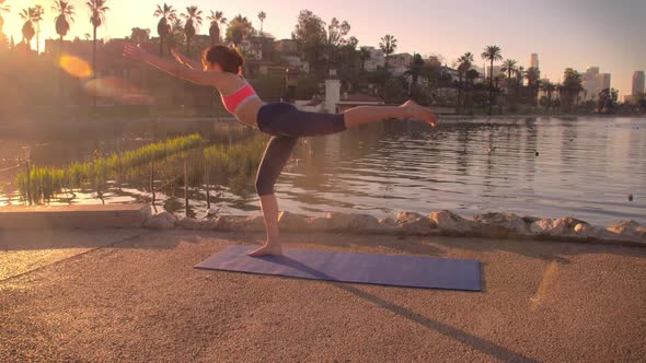 Woman Doing Yoga In The Park At Dawn