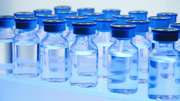 Group of Vaccine bottles. Medicine in ampoules. Glass vials for liquid samples in laboratory.