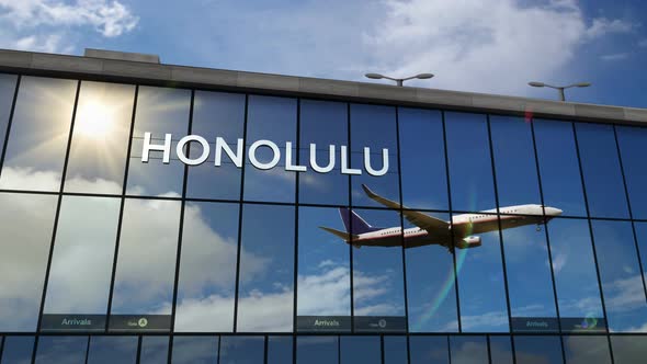 Airplane landing at Honolulu Hawaii, USA airport mirrored in terminal