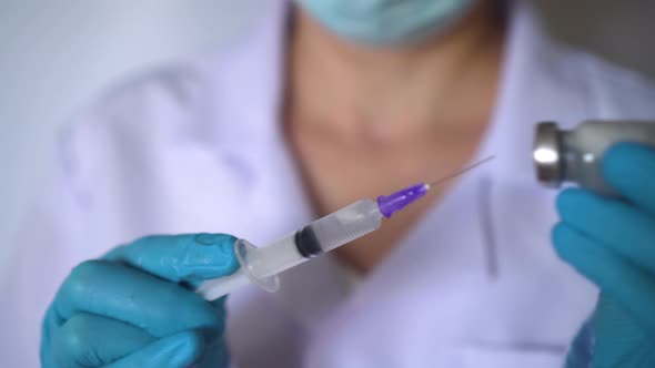 Doctor Preparing Covid19 Vaccine Dose for Vaccination