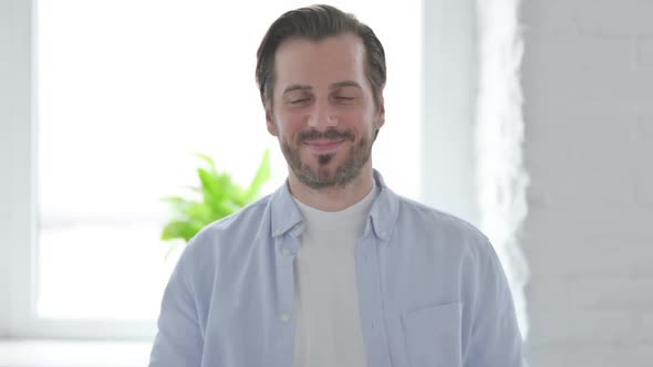 Portrait of Young Man Smiling at Camera