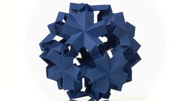 Blue Origami Flower on White Background.