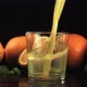 A Stream of Orange Juice with Splashes Pours Into the Glass - VideoHive Item for Sale