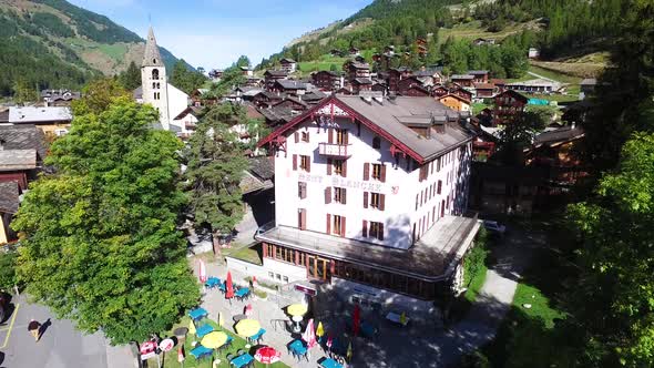 Aerial shot of typical swiss alpine village (Evolène, Valais - Switzerland)