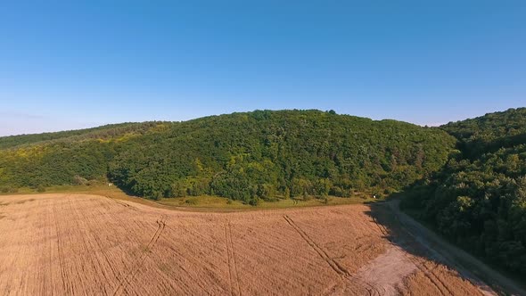 Crop fields seen from the air. Aerial view from flying drone of land fields in countryside