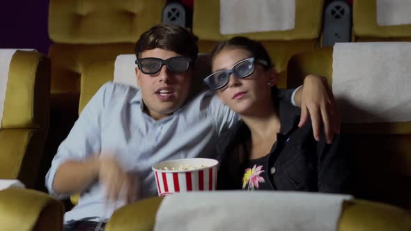 Man and Woman in the Cinema Watching a 3D Movie