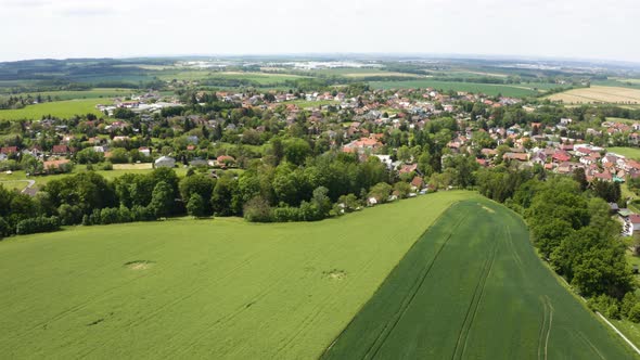 Aerial Drone Shot  a Picturesque Town Surrounded By Fields in a Rural Area  Drone Flies Forward