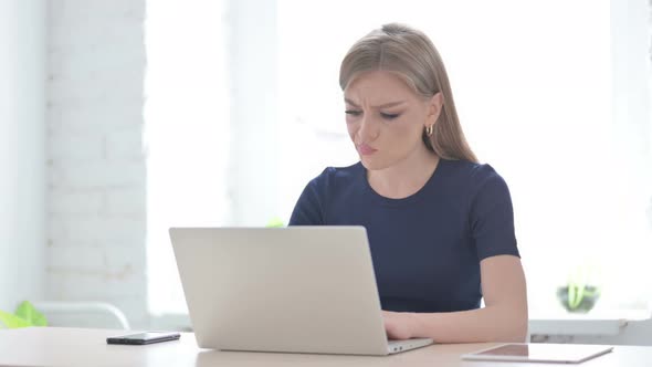 Angry Woman Working on Laptop in Office