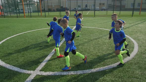 Active Young Footballers Playing During Warm-up