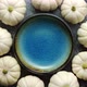 Small White Baby Boo Mini Pumpkins Placed in Circle with Blue Ceramic Bowl in the Middle - VideoHive Item for Sale