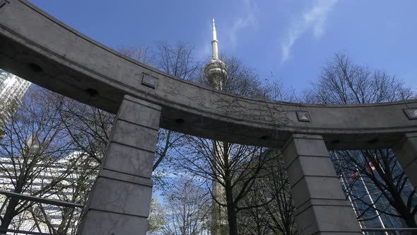 CN Tower seen behind a colonnade