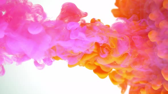 Orange and purple ink paint colliding