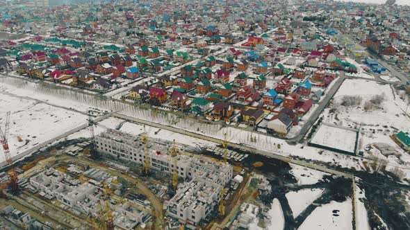 Construction in Progress Site Against Residential Complex