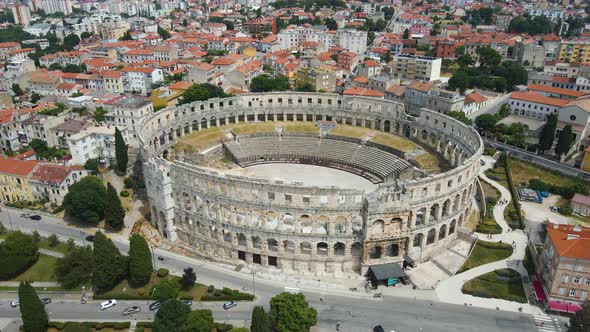 Aerial rotating shot of colosseum Building or Pula Arena Croatia Amphitheatre which is a popular his