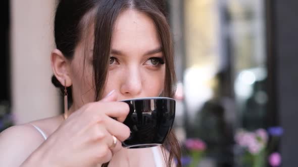 Close Up Portrait of a Beautiful Bride Drinking a Cup of Coffee