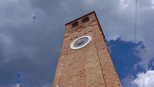 Ancient Clock Tower with Clouds in the Background