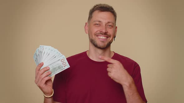 Man Holding Money Dollar Cash Like a Fan Success Business Career Lottery Winner Income Wealth