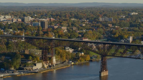 Aerial of walkway over Hudson river and town at a distance