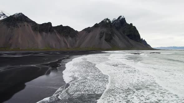 Drone Over Black Sand Beach Sea And Vestrahorn Mountain