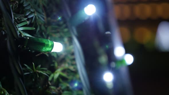 Christmas tree decorative bulbs blinking close-up 4K 2160p 30fps UHD footage - New Year and Xmas dec