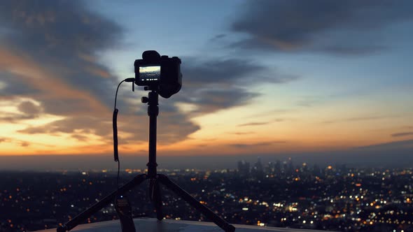 The camera captures the view of the sunset in LA