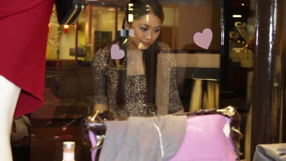 MS, Asian Female looking at window display of shop