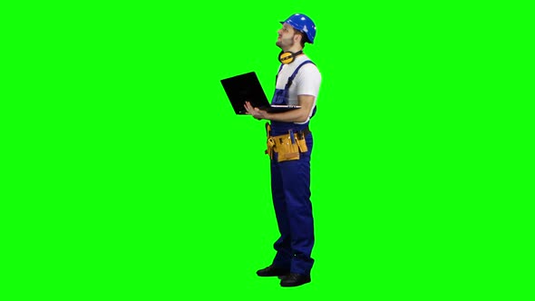Foreman with a Laptop Says How To Build a Building. Green Screen