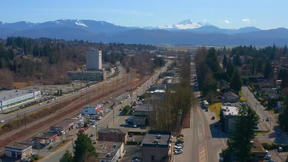 Drone View of a Scenic Mountain Town near Mt Baker as Cars Drive on the Streets Below
