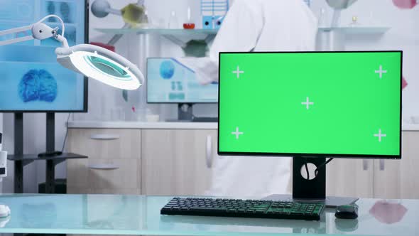 Computer with Green Screen Mock Up on Doctor Desk