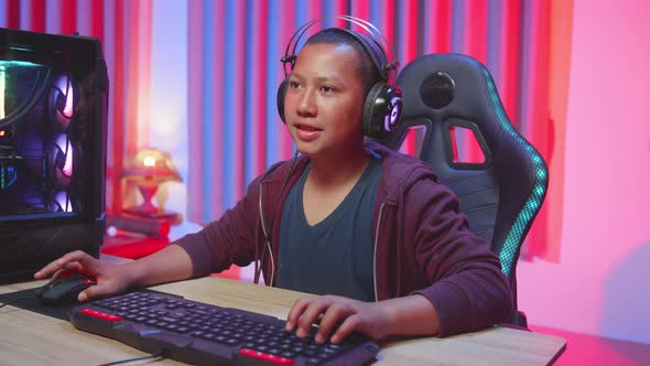 Child In A Headset Focused On A Computer Game