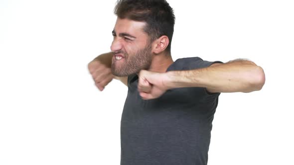 Slow Motion Ecstatic Smiling Guy in Grey Tshirt Dancing Wildly Full of Energy Making Uncontrolled