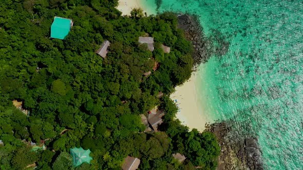 Aerial view of long-tail boat at sea, view from above. Aerial video of Long tail Boat floating in a