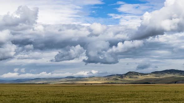 Stormy Clouds Over Farmland in Alberta Foothills  Timelapse