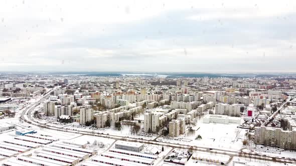 Kalnieciai district in Kaunas city covered in white snow during heavy snowfall, aerial view
