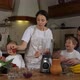 Children with Parents is Preparing a Smoothie at Domestic Kitchen Together - VideoHive Item for Sale