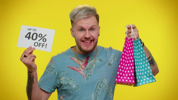 Cheerful Tourist Man Showing Shopping Bags and Up To 40 Percent Off Inscriptions Banner Black Friday