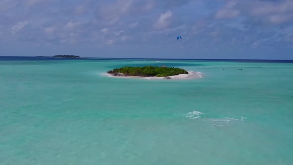 Drone scenery of tourist beach by blue sea with sand background