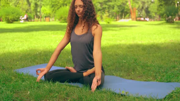 Slim Girl Doing Yoga Asana in Urban City