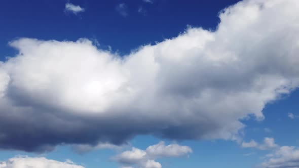 Clouds timelapse on a blue sky