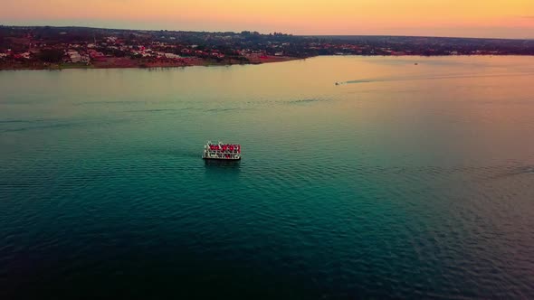 Aerial shot rising up above Lake Paranoa at dusk