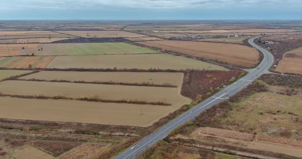 Aerial View of Highway Road in Middle of the Farm Fields