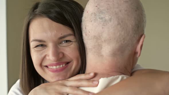 Young Woman Hugs Her Native Cancer Patient