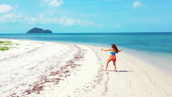 Women posing on idyllic resort beach lifestyle by blue green lagoon and white sand background of Koh