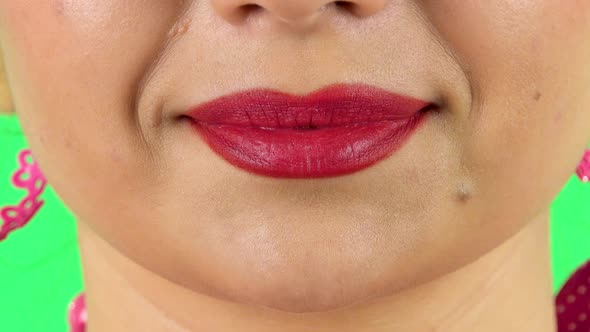 Young Woman with a Red Lips Smiles. Close Up