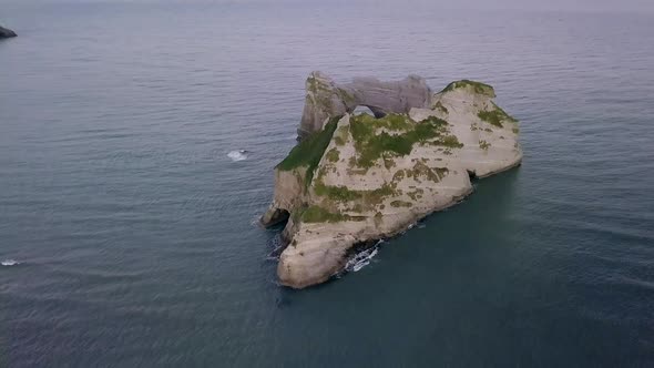 Rocky islet with tunnel