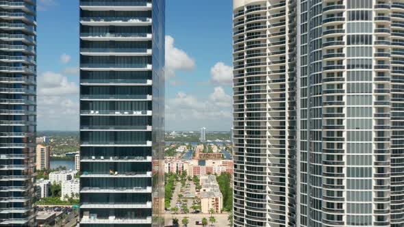 Drone Flying Between Two Tall Modern Skyscrapers Towers