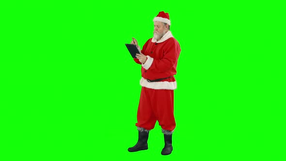 Santa claus using digital tablet