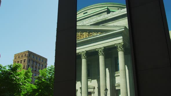 Bank of Montreal's reflection and Notre-Dame Basilica